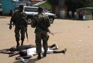 Soldiers drilling suspected criminals at Ho