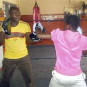 Lillian sparring with her dad at the Attoh Quarshie Gym