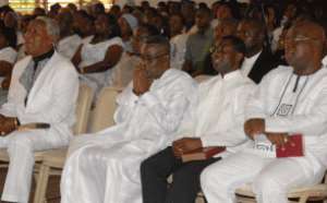 President Mills Seated second left, front role in a prayerful mood at the service.