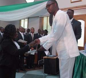 One of the forest prosecutors receiving her certificate from Mr. Samuel Afari Dartey.