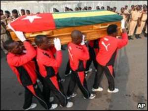 Togo players carrying their colleague