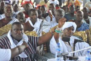 Nii Ayi Bonte 11 (left), Gbese Mantse and Ga State Adonten, shows the 'afili' a bangle (Ga Chief baton) used by the late Nii Amugi on the hands of the new Ga Mantse, King Boni Nii Tackie Adama Latse 11 at the news conference in Accra.