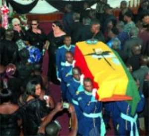 The coffin bearing the mortal remains of Squadron Leader Clend Sowu carried by pallbearers