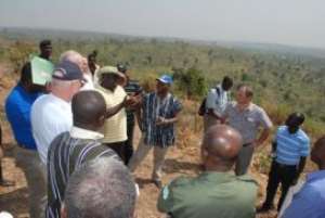 Mr Raphael Yeboah (in hat middle) of the Forestry Commission explaining a point to officials of the Netherlands Embassy, the Ministry of Lands and Forestry, and Form Ghana at the plantation site at the degraded Asubima Forest Reserve