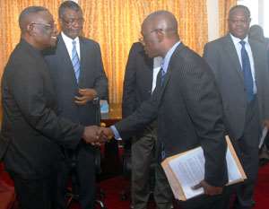 President Mills receiving the damning EOCO report from Mortey Akpadzi while Chief of Staff, Henry Martey Newman looks on