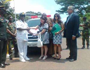 The CDS Receiving The Keys To The Ambulance From Madam Rani Melwani Of Melcom