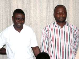 The two policemen in police custody