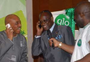 Ambassador Amihere middle, interacting with Mr Shangowaawa on Glo's mobile network.