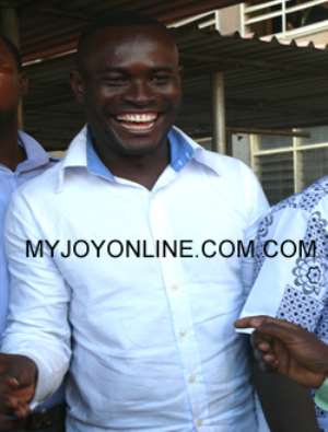 John Kumah in a flashy smile after his release