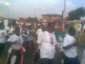 Nii Nortey Dua, Deputy Minister of Sports leading the 'Hon Nii Adjei-Boye Sekan' 5th anniversary health walk through the streets of Teshie, a suburb of Accra