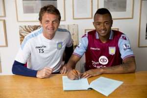 New signing Jordan Ayew of Aston Villa poses for a picture with Aston Villa manager Tim Sherwood