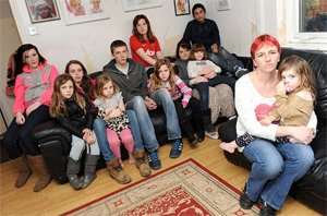 Family affair: Frost pictured with her 11 children including Toby, 19, and Sophie, 21 who also live on benefits