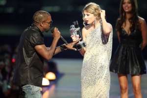 Kanye West has apologised after jumping on stage during Taylor Swift's acceptance speech at the MTV Video Music Awards in New York.