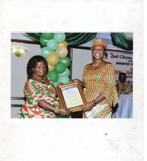 Kate Quartey-Papafio (left) receiving her award from Juliana Azumah Mensah, Minister of Women & Childrens Affairs