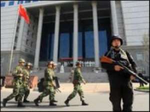 China sentences five to death over riots
