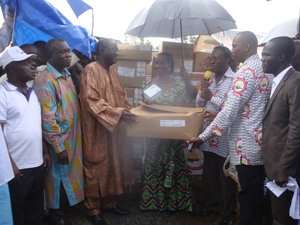 Minister of Health, Hon Sherry Ayittey receiving the essential drugs donated by PSGH from James Ohemeng Kyei