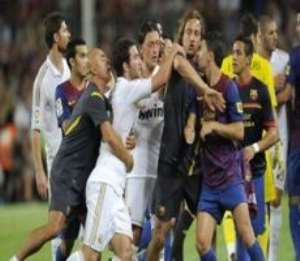 Barc and Real players square up against each other during a recent El Clsico