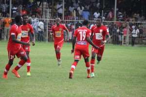 Asante Kotoko players celebrating a goal.