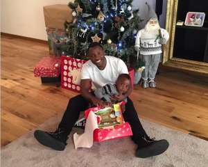 Kwadwo Asamoah wishes fans a 'Merry Christmas' from his Italy base with son