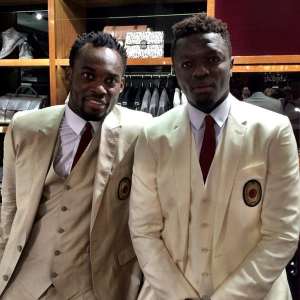 Ghana duo Sulley Muntari and Michael Essien model in new AC Milan DG suits