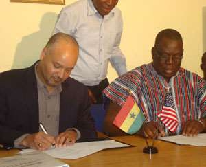 Northern Regional Minister and Mr. Paul Weisenfeld signing the MOU
