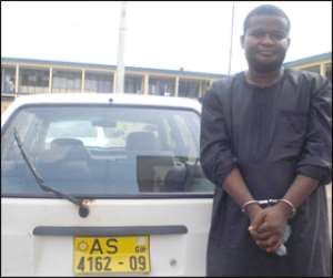 Eric Appiah with the stolen vehicle