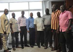 Dr Aubynn third from right in a group photograph with executives of NASWOTTU