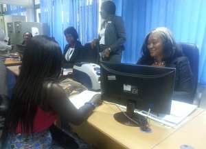 Ecobank top executives serve customers for a day
