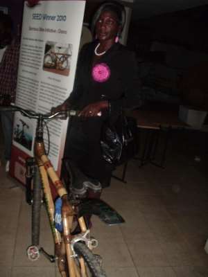 Bernice besides one of Ghana Bamboo Bikes