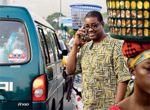 Ghanas renowned ICT wizkid Herman Chinery-Hesse, on his cell phone