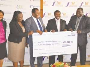 SPORTS Minister Chishimba Kambwili (right) and sports permanent secretary Agnes Musunga (left) witness the donation of a K100,000 cheque by Meanwood Group chairman Robinson Zulu (second left) to ZNBC director-general Chibamba Kanyama.