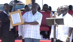 President Kufuor Commend Workers