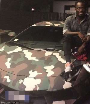 Ghana star Michael Essien poses with Sulley Muntari's posh Lamborghini while on holiday