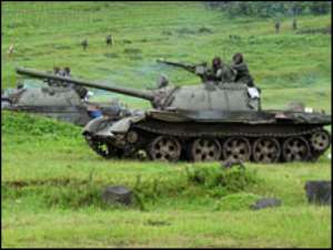 Battles rage near key Congo town