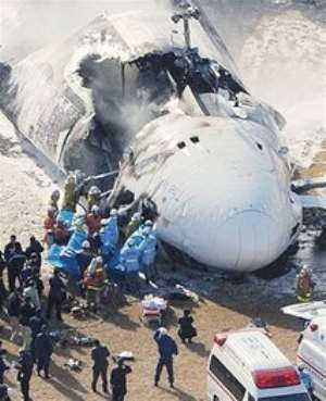 AP – Emergency personnel try to rescue the crew from a FedEx cargo plane after it crashed and burst into flames 