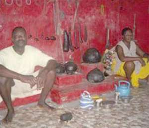 Manford with a priestess at the Nana Atia shrine