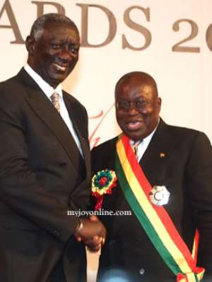 Nana Akufo-Addo right in a handshake with ex-president Kufuor