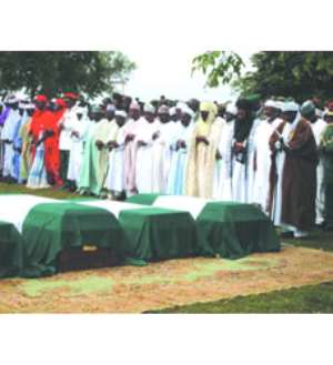 Muslim clerics praying for the deceased