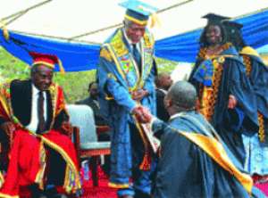Mr Kofi Annan 3rd left Chancellor of the University congratulating one of the graduates at the congregation in Accra.