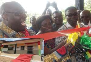 Papa Owusu-Ankomah (left) being assisted by some of the dignitaries to cut the tape to inaugurate the ICT centre. Inset: The ICT Centre