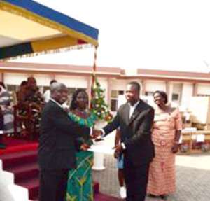 One of the award winners receiving his certificate of honour