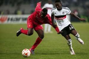 Ghana defender Daniel Opare stops Liverpool 's Balotelli