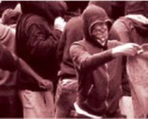 Youths loot a Carhartt store in Hackney during the recent riots in London.