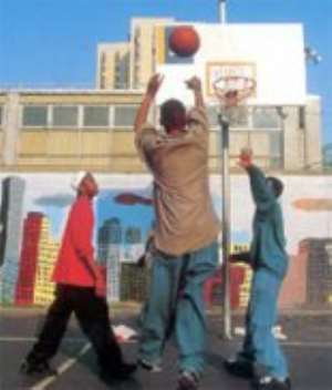 Some boys playing basketball