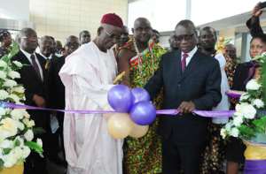 Alhaji Adamu Iddrisu and Dr K.K. Sarpong cutting the tape to launch The Royal Bank in 2012