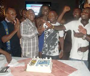 Friends and family join Agbeko to cut the birthday cake