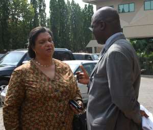 Ms Hannah Tetteh, Trade Minister, conferring with Mr Oshikoya, Director of WAMI