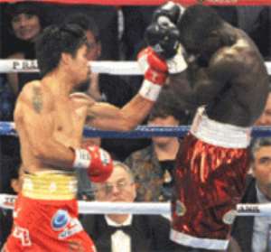 Manny Pacquiao left trying to penetrate Joshua Clottey