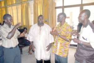 Nathan Pecku (R), Head of Special Education of GES holding conversation with E. Sackey (L), Prez of Association of Deaf, Peter Obeng-Asamoah and Samuel Asare