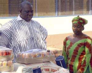 Moses Abukari Mabengba donating items to the Home